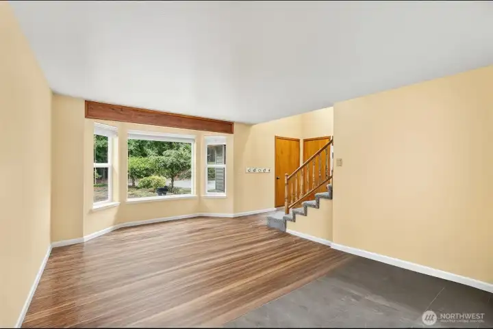 The wood flooring is consistant through out both front room and dining area