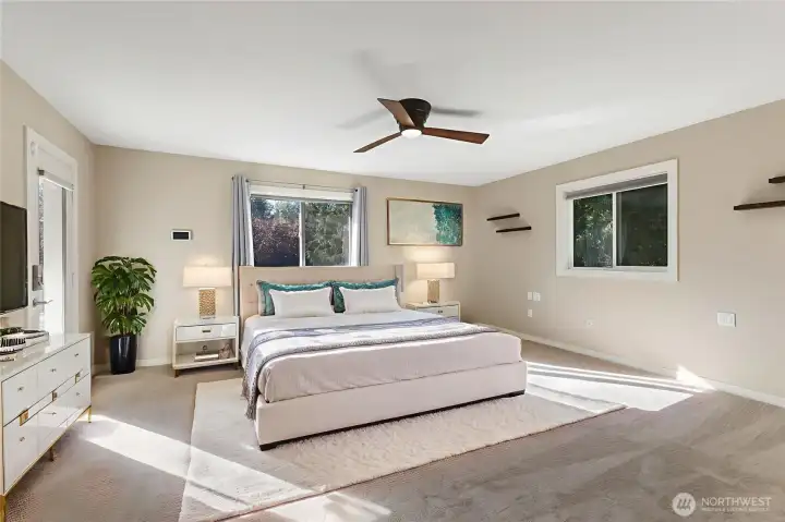 Luxurious primary suite feels like a private sanctuary with a spa-style 5 piece bath, deck access and walk-in closet featuring a newling installed California Closet organizing system.
