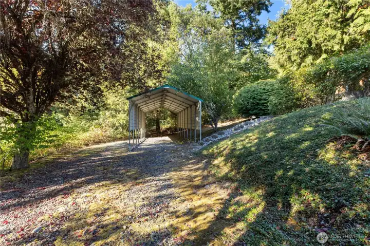 Extra parking space with covered area for an RV or boat.