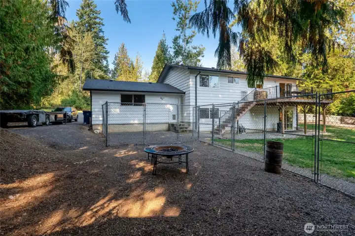 Outside, enjoy a huge fenced backyard with space for garden beds, tons of parking including RV parking, plus a two-car garage