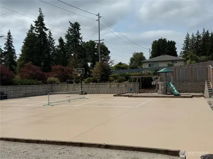 HOA's Private Recreation Court.  Shared between only 19 homes and their guests, this recreation area includes pickleball, basketball, swings, big toy, bocce ball, and open area.