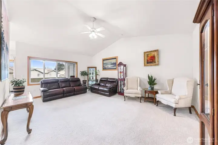 Vaulted ceilings and large windows with plenty of room for your furniture
