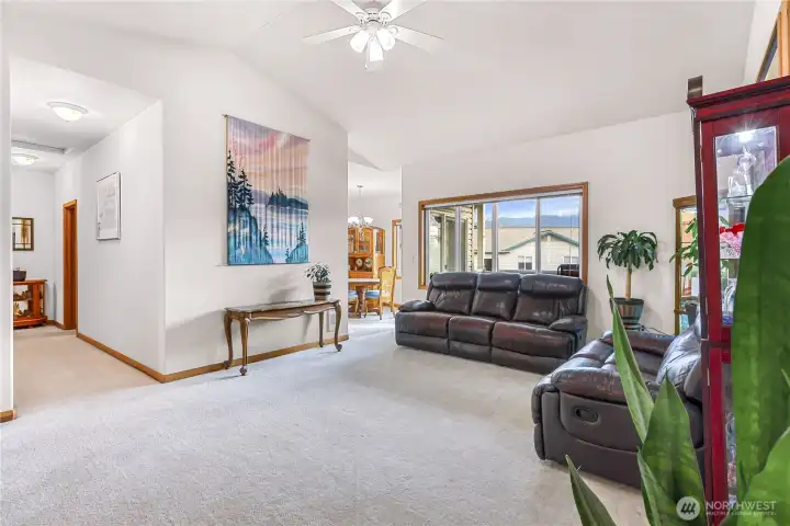 View from front door that shows hallway of bedrooms and main bathroom