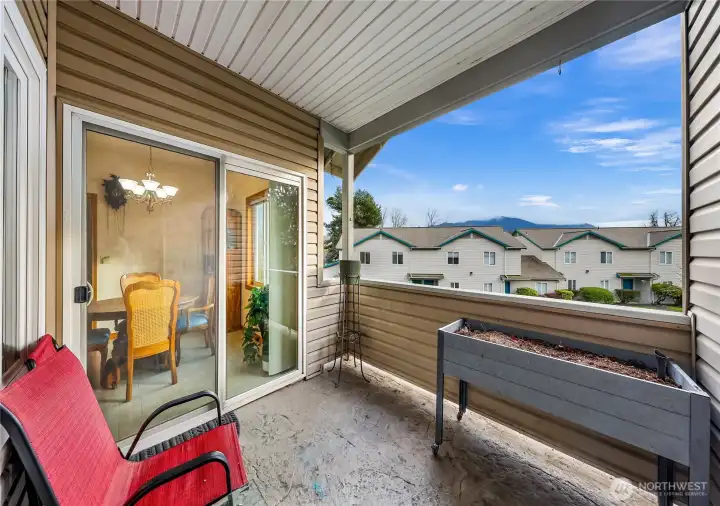 Indoor and outdoor living possible with the perfect covered space right off of dining area