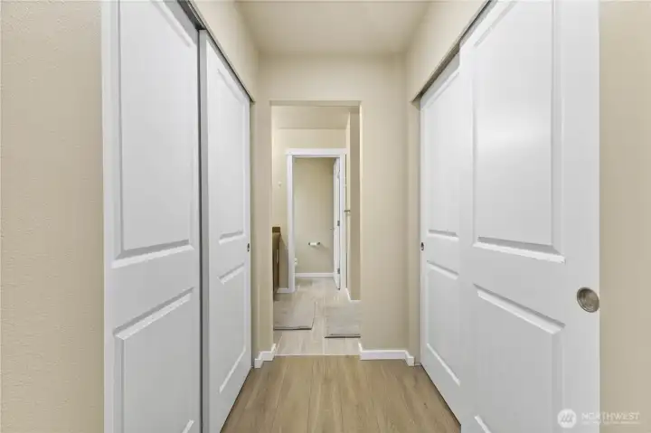 Closet space leading to primary bath