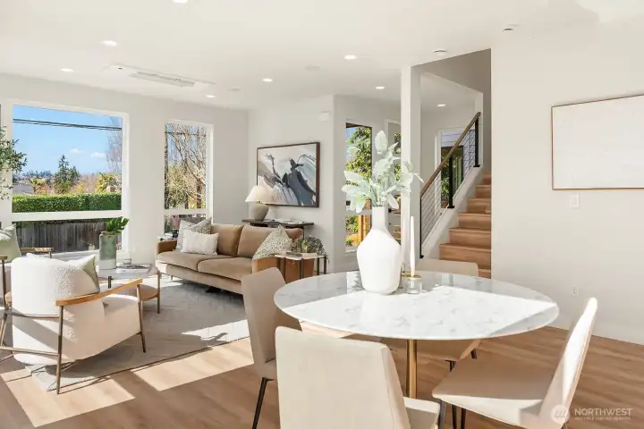 A look towards entry door and staircase. Generous dining space with access out to the yard/patio.