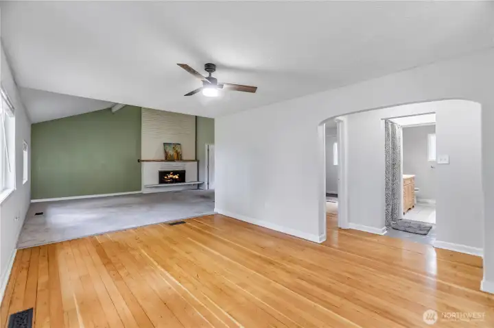 Entering the home, you are greeted by restored original wood floors.