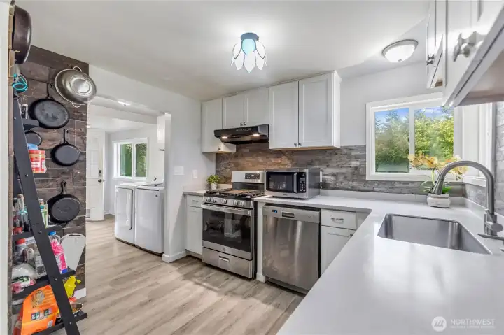 The washer and dryer are included. The back door leads to the garage.
