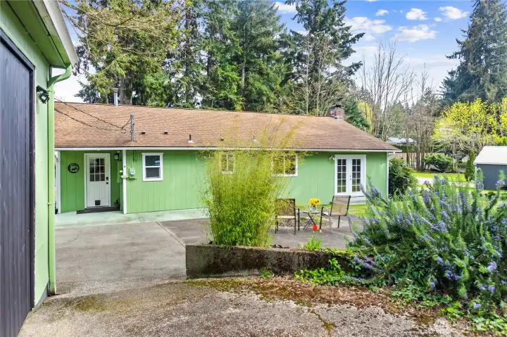 Conveniently located just steps from the back door, the garage and shed are easily accessible.