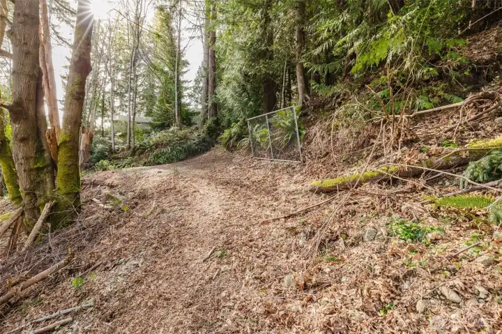 According to seller, fence post is on property line. The pegs inside of the property show the 5' setbacks required by the County for building purposes.