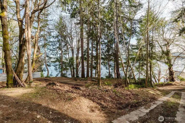 Concrete drive is an easement for the neighbor. This view is looking towards the easement entrance at North Shore.