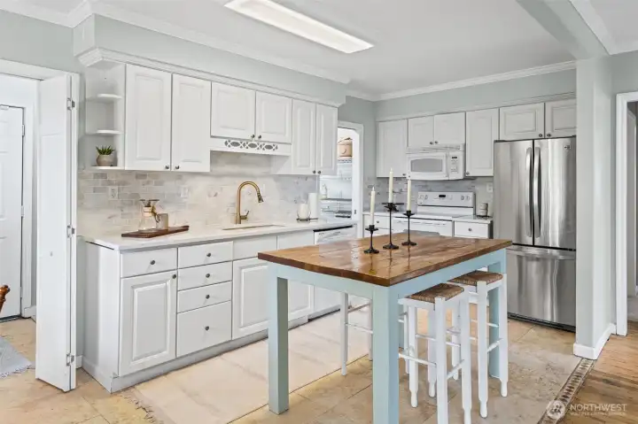 Spacious kitchen with adorable butcher block island