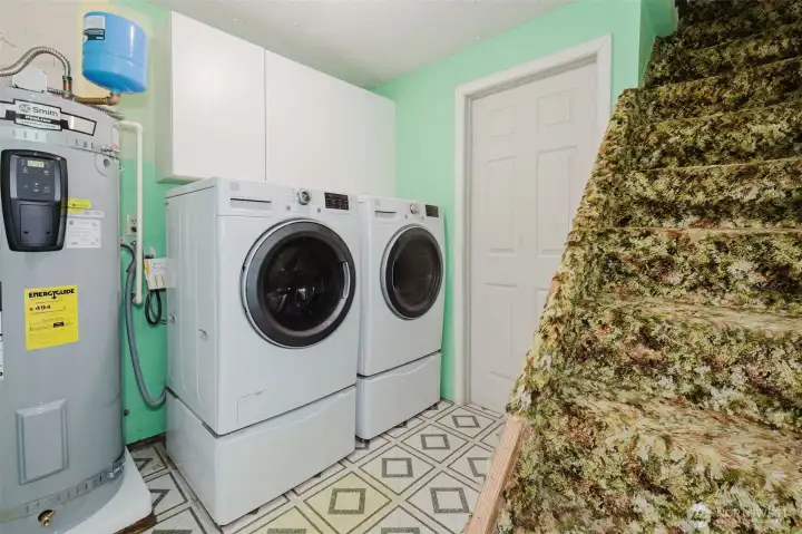 Laundry, door to garage, stairs up to loft