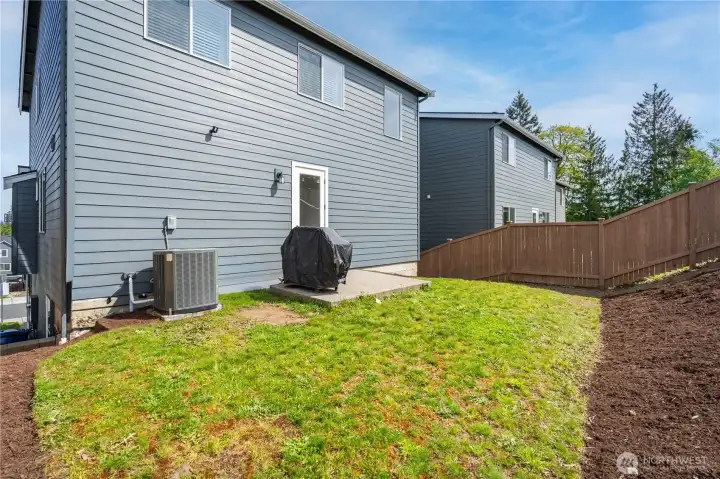 Large backyard with porch for grilling and  fenced on both sides for privacy
