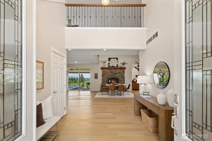 Enter onto the main level with souring ceilings