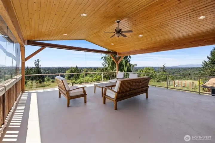 Bask in the views from the upper level deck! Ceiling fan helps keep you cool on the warmer days. Luxury features include a clear wind blocker along the left side of the deck, and privacy shades on the front of the deck and doors.