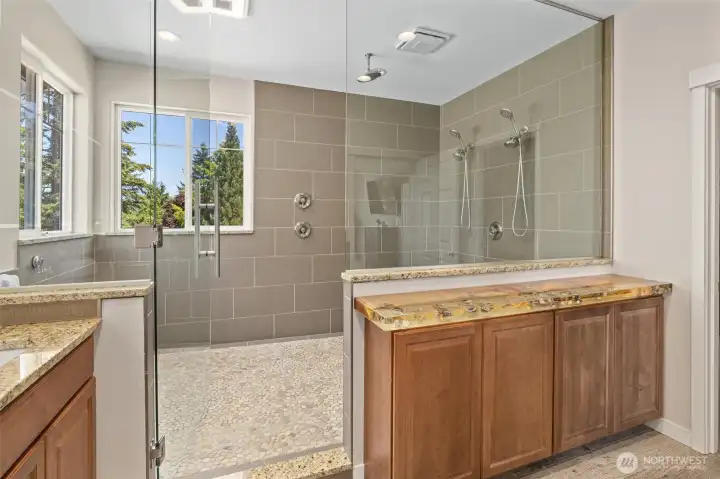 Oversized shower with 3 shower heads. The epitome of luxury!