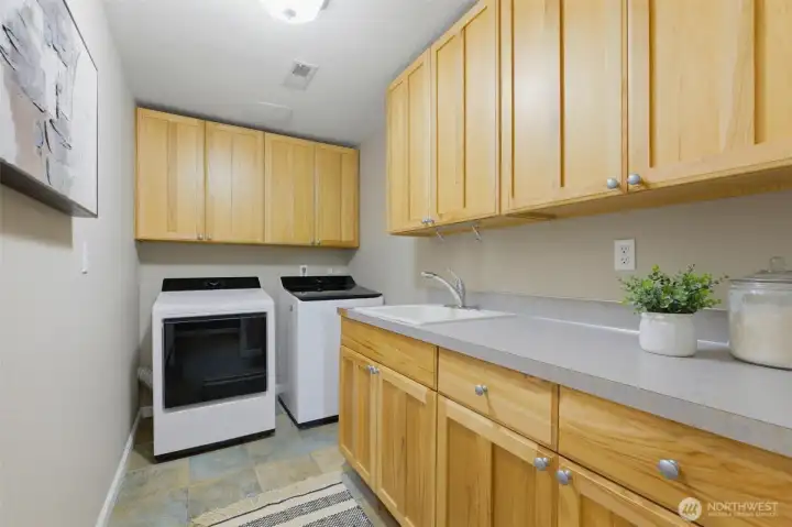 Upstairs laundry room off garage.