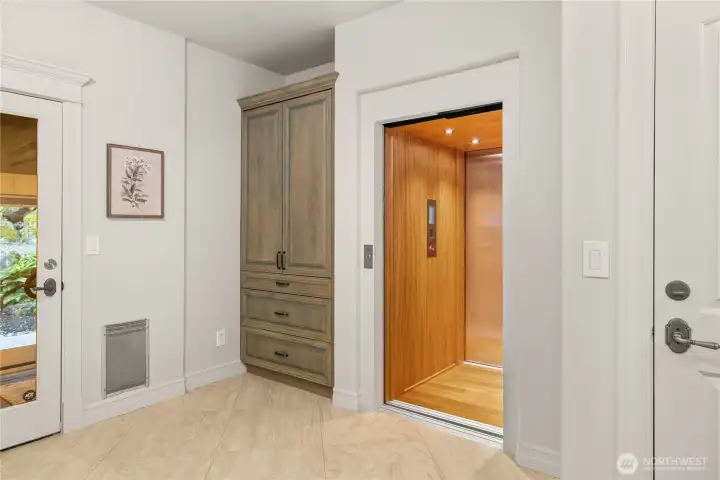 A Brazilian cherry wrapped elevator takes you between the garage, main and upper floors. A Brazilian cherry wrapped elevator takes you between the garage, main and upper floors.