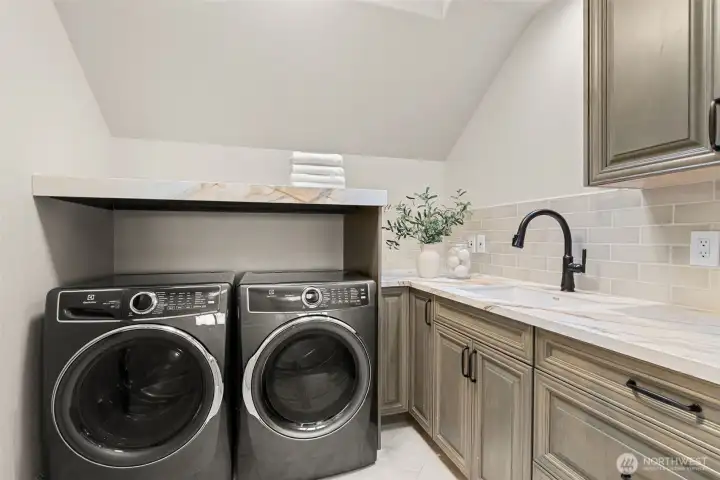 Second-floor laundry room serving the second-floor bedrooms. Second-floor laundry room serving the second-floor bedrooms.