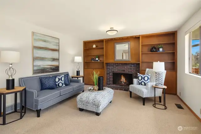 The family room features a wood/gas fireplace surrounded by built-ins for all your books, games, and pictures.