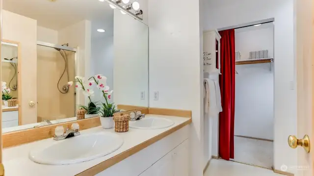 Enjoy double sinks and walk-in shower in this primary bath en suite with spacious walk-in closet.