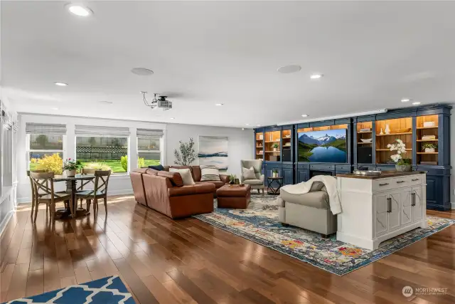 Amazing family room/entertaining space opens up to the large outdoor covered deck.