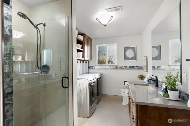 Laundry shares space with a 3/4 bath - very nicely done!