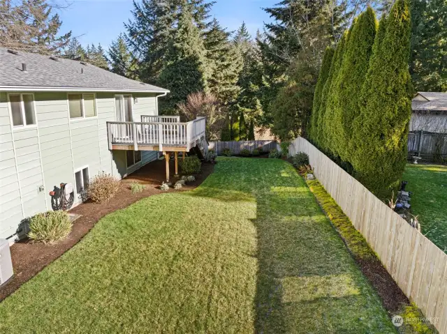 Oversized yard with terraced levels on the side of the house - plenty of room for your favorite outdoor activities.