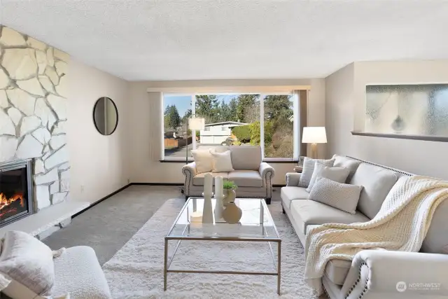 Spacious Living Room w/wood burning fireplace.