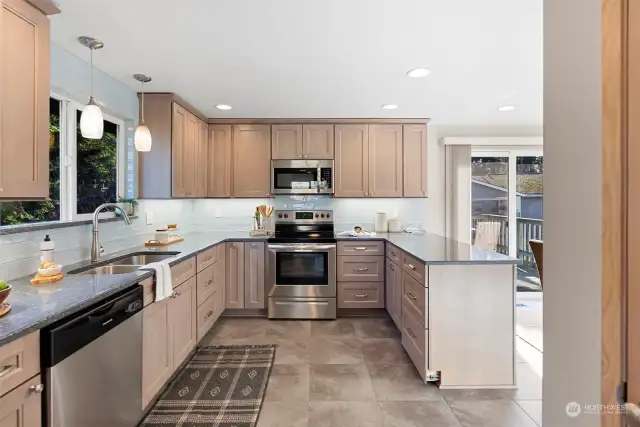 Updated kitchen - gorgeous cabinets, tile floor, cambria countertops - all new in 2022.