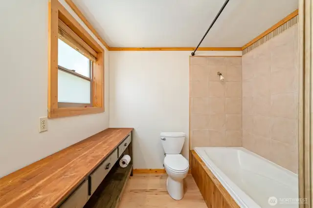 The full bathroom is on the main floor, to the right of the front entrance.