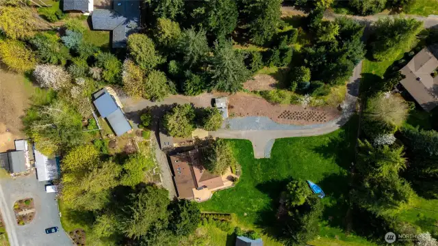An overview of the property shows the main house (center), new ADU (just above main house), and Hill House (garage/shop with kitchen/bath). And with all that, there is still plenty of garden, lawn and walking paths in the trees!