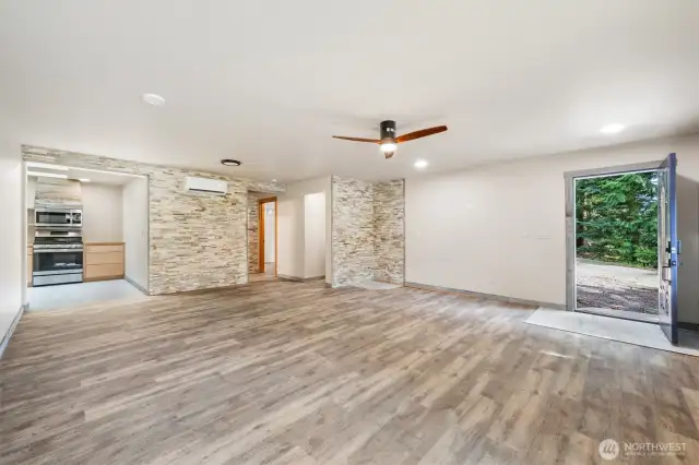 Inside the newly built ADU, with stacked-stone wall accents and an open layout.