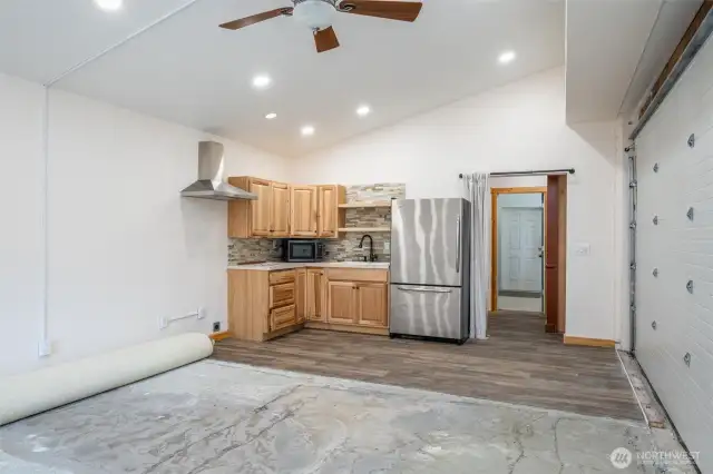 Inside "Hill House" garage/shop, there is a kitchenette, bathroom and laundry just past the doorway.