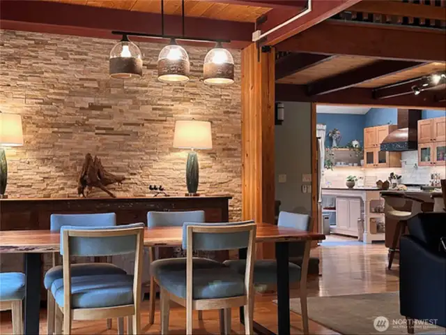 The dining area with stacked-stone wall. (home is currently vacant)