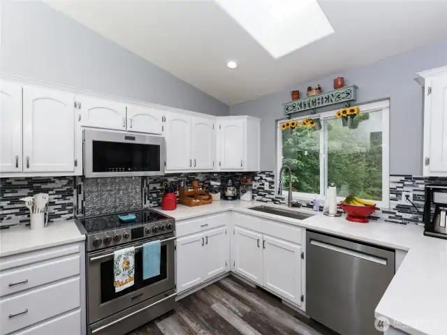 Updated Kitchen w/ Kitchen is STUNNING w/Quartz Counter and Fantastic Tile backsplash