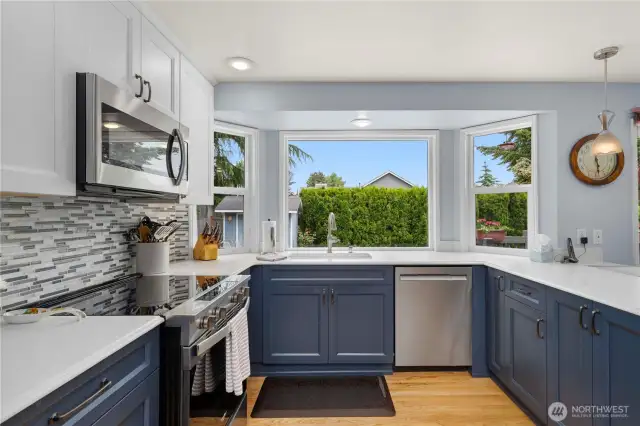 Look out to the lovely back yard from your large kitchen windows.