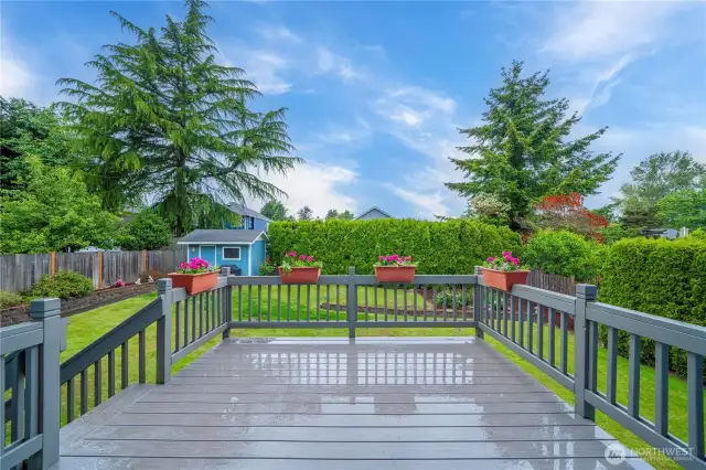 Out the sliding glass door is this large deck with planters that stay.