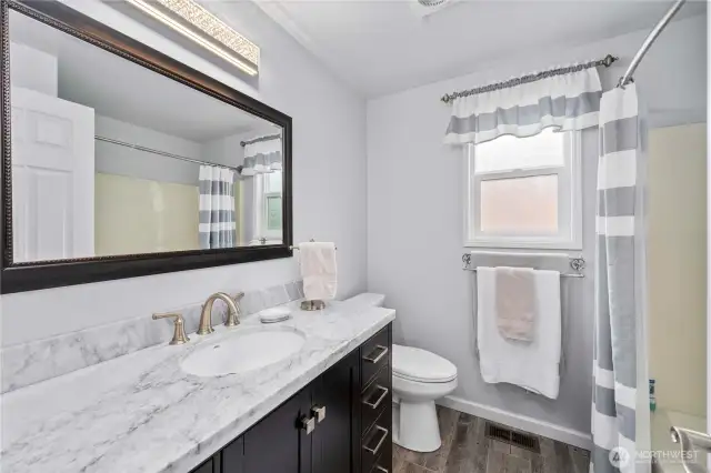 The full bath on the upper level is also updated.