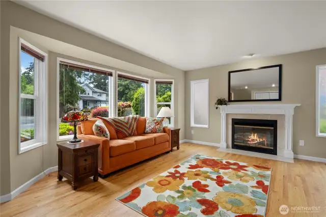 Enjoy the fireside living room with large picture windows.