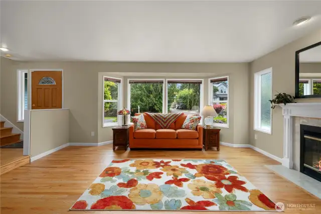 Enjoy the fireside living room with large picture windows.