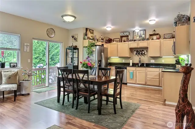 Dining area w/sliding glass door to wrap-around deck.
