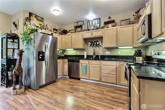 Beautiful granite countertops and stainless steel appliances.