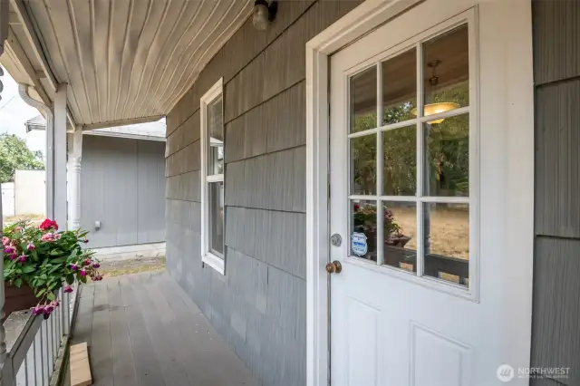 Side porch leading to the detached 1 car garage.