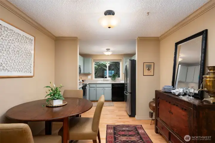 Dining room connects the kitchen to living toom.