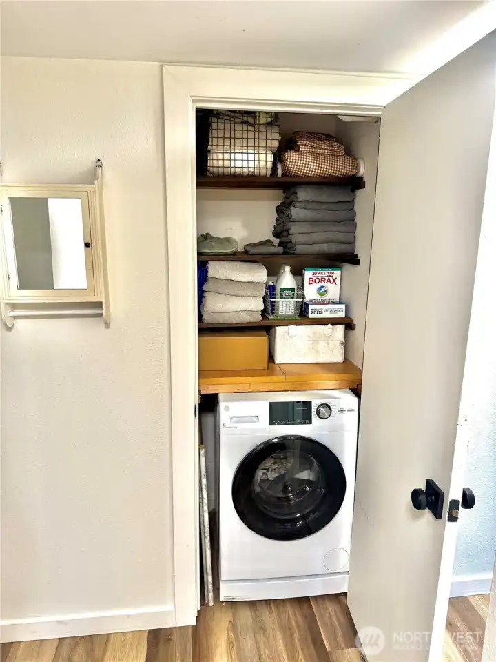 Dual washer/dryer in the hallway