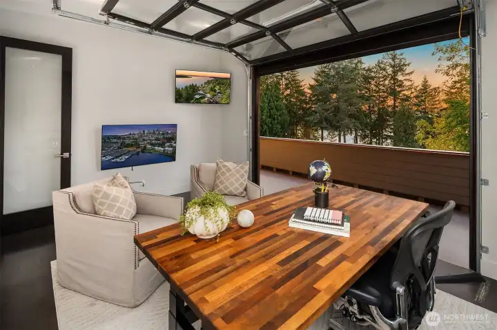 Den/office #1 off Primary with glass roll up door to enjoy the lake and city views