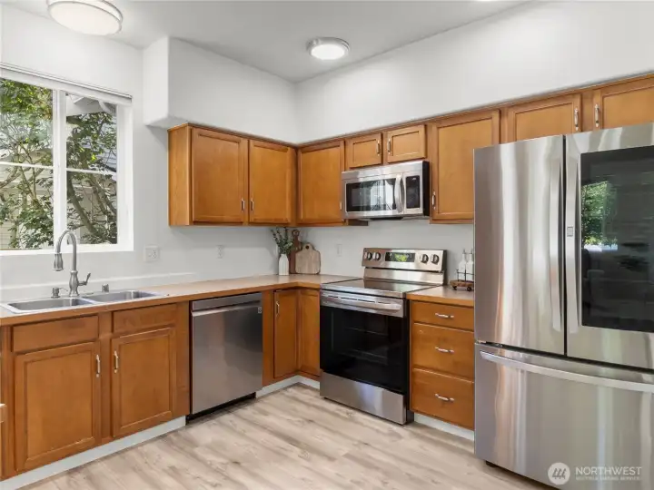 Kitchen with newer SS appliances.