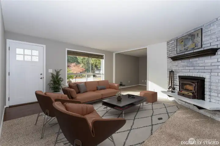 Inviting and full of natural light, the wood burning fireplace insert offers great warmth during the winter.